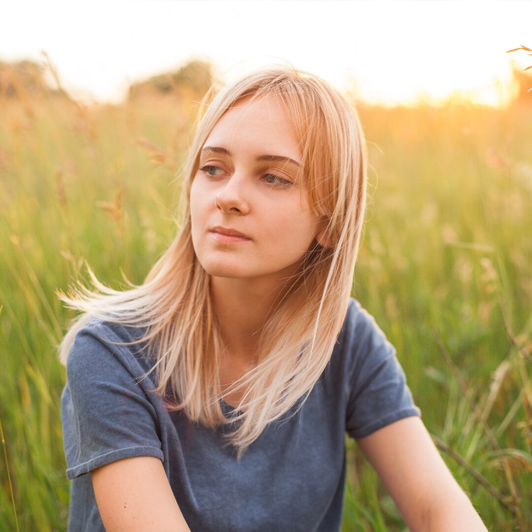 Young woman experiencing pressure from her parents to get an abortion